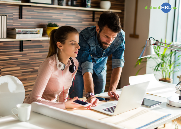 Two colleagues work together to analyse a challenging task, identify potential issues, and make the most of the probationary period.